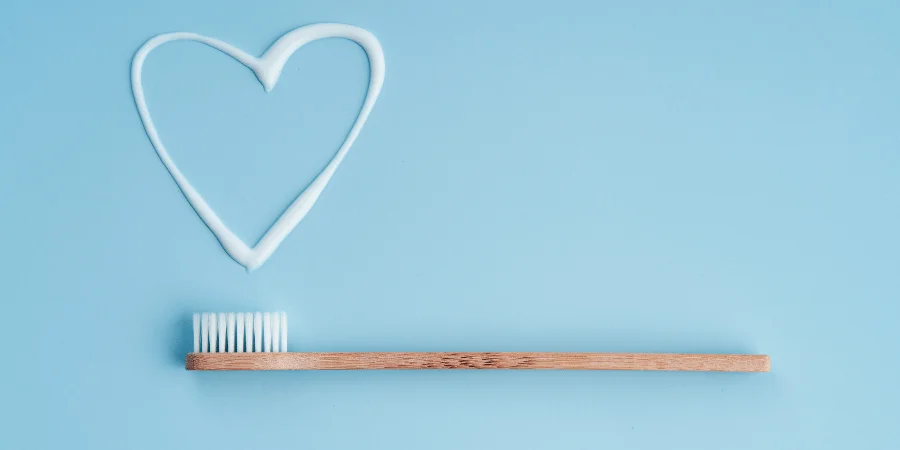 A toothbrush with toothpaste next to it, serving as a rough 6-inch measurement.