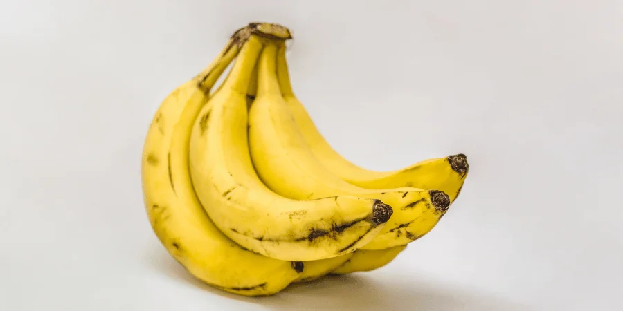 A bunch of medium-sized bananas on a white background.