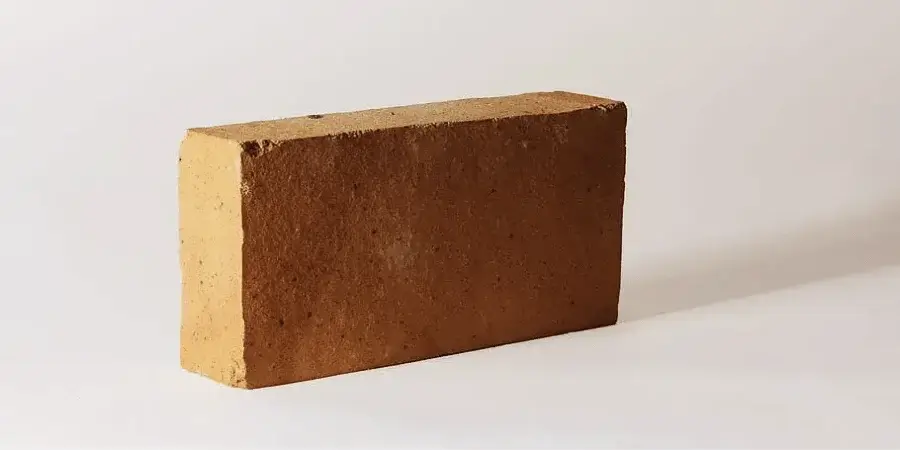 Half of a standard brick, measuring approximately 4 inches in length.