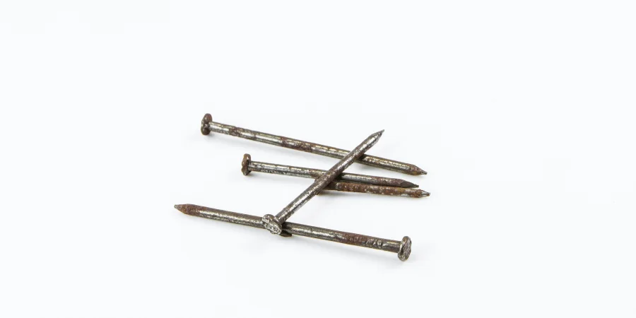 Three 3-inch iron nails arranged together for measurement reference.