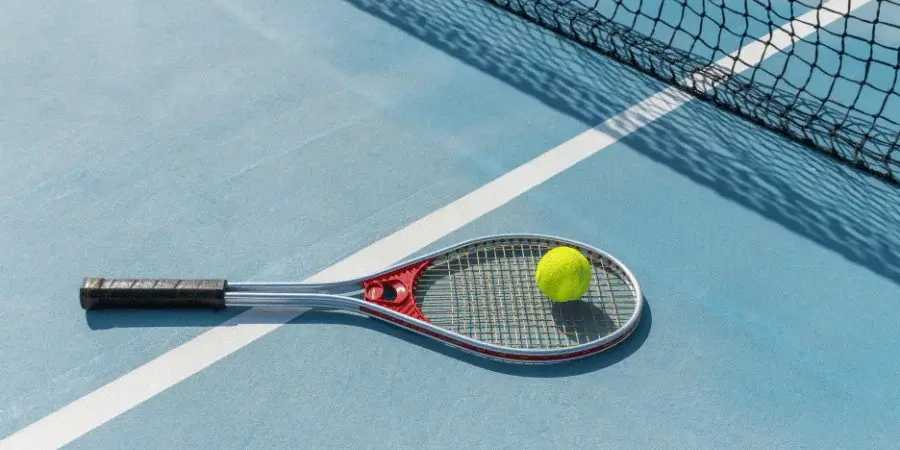 A tennis ball on a court, useful for rough measurements, around 2.7 inches in diameter.