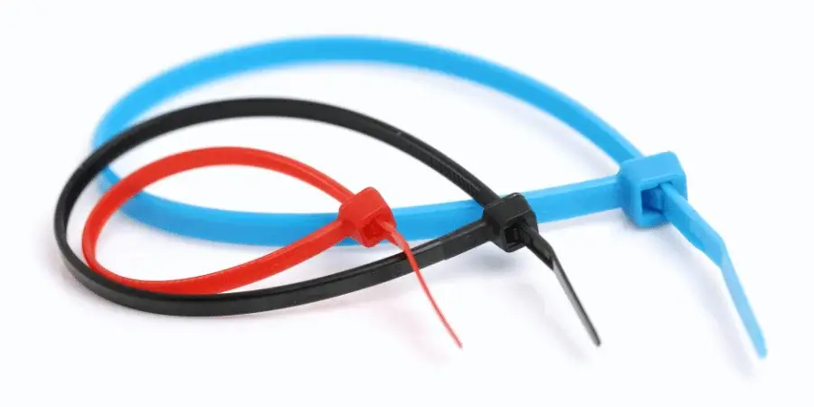 Red, black, and blue zip ties, each approximately 3 inches in length.