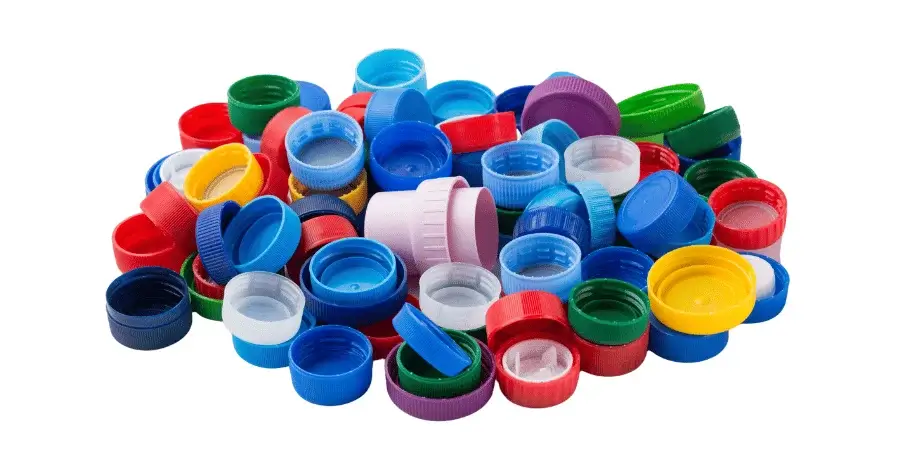 A pile of colorful bottle caps, arranged to approximate 16 inches.