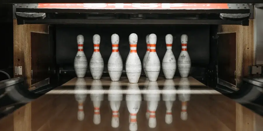 Bowling pins arranged, showing 18 inches when adding one-fifth of a pin’s height.
