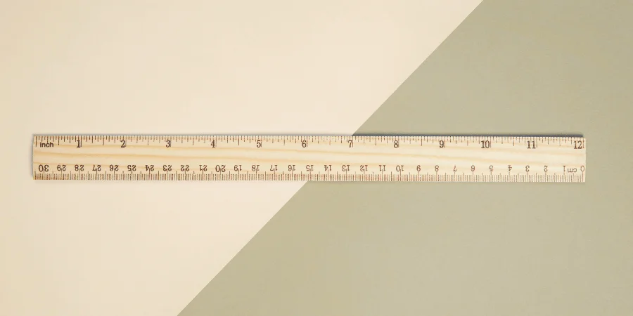 Close-up of a wooden ruler showing the 10-inch mark clearly visible.