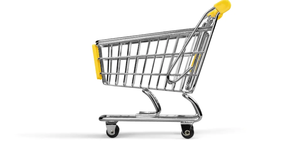 A side view of a small shopping cart with yellow accents, commonly used for grocery shopping.