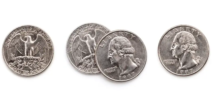 Sixteen US quarters laid out in a row, measuring 16 inches in total.