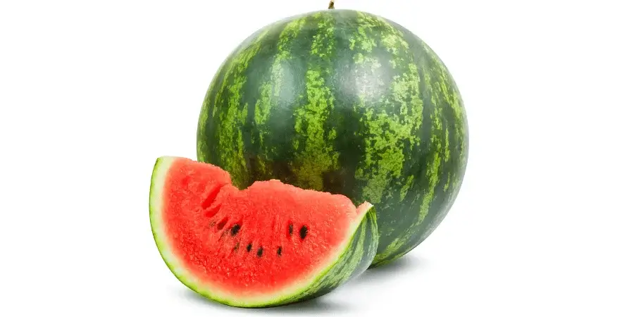 A whole watermelon with a sliced wedge showing its juicy, red interior and black seeds.