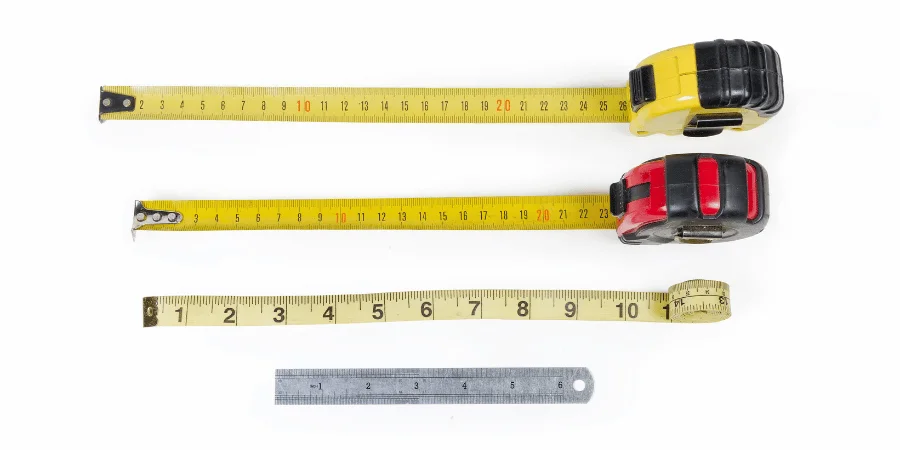 Various measuring tools including tape measures and a ruler.