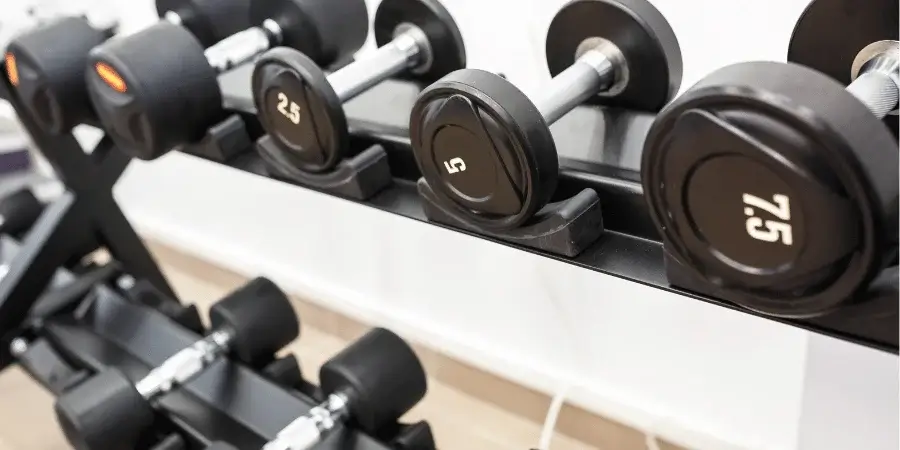 A rack of dumbbells, with 7.5kg weights that total 30kg when combined.