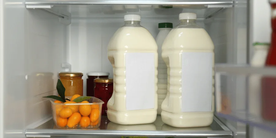 Two large bottles of milk, representing eight gallons weighing 30kg.