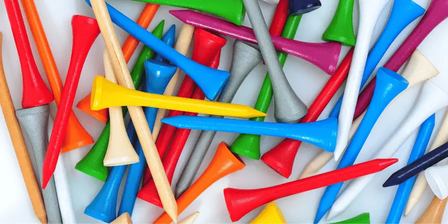 A colorful assortment of golf tees in various bright colors, ideal for outdoor golfing.