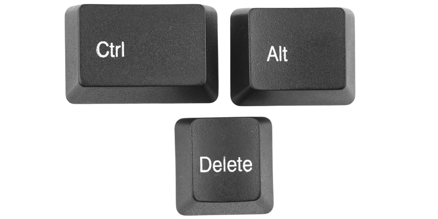 Close-up of black Ctrl, Alt, and Delete keyboard keys isolated on white background.