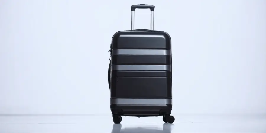 Sleek black 20 inch carry-on suitcase with spinner wheels ideal for travel, lightweight and durable design