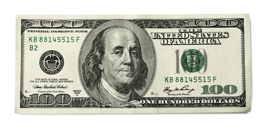 $100 US bill featuring Benjamin Franklin, showcasing the front design and security features of the currency
