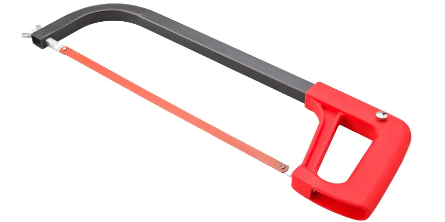 Hacksaw with a red handle and metal blade, perfect for DIY cutting tasks.