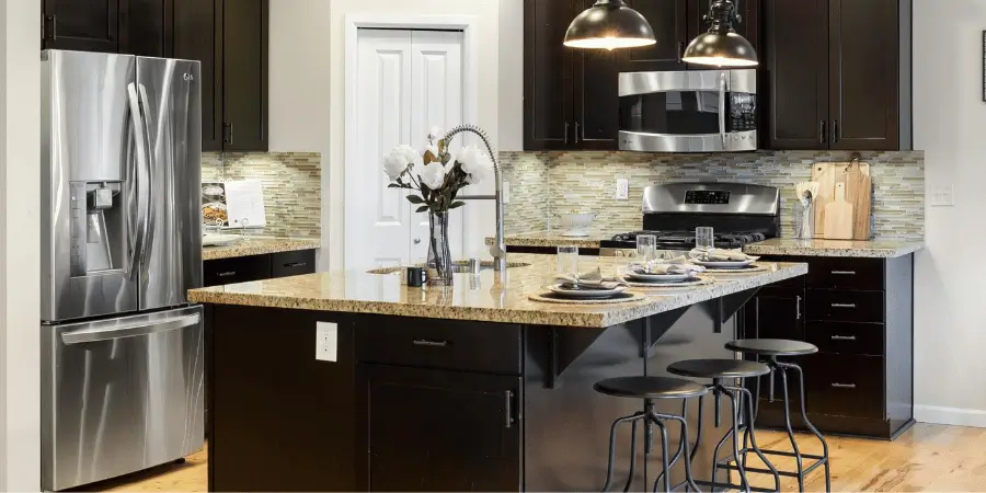 Modern kitchen with sleek appliances and a spacious island countertop.