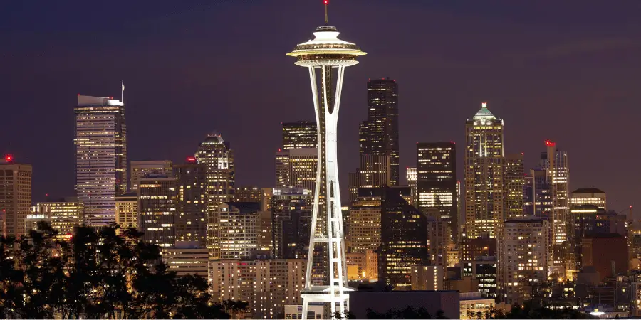 Seattle Space Needle at night skyline, iconic observation tower in Washington, modern architecture and city landmark attraction.